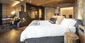 Spa Suite in Livigno mit Kingsize-Bett und romantischer Alpenatmosphäre